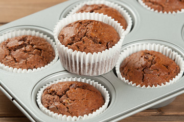 Homebaked Muffins With Chocolate, Banana, Coconut In Baking Tray