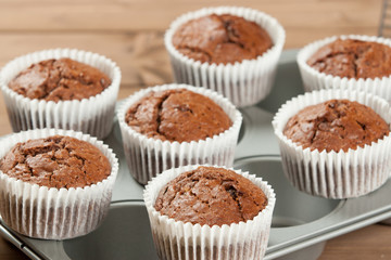 Homebaked Muffins With Chocolate, Banana, Coconut In Baking Tray