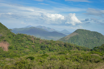 Fototapeta na wymiar Beautiful landscapes of various volcanic peaks in the distance seen from the top of Telica Volcano, in San Jacinto near Leon, Nicaragua. Central America