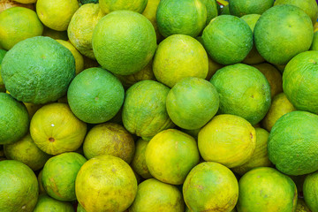 Pile of Citrus aurantium for sale in Thailand market. It is a hybrid Citrus.