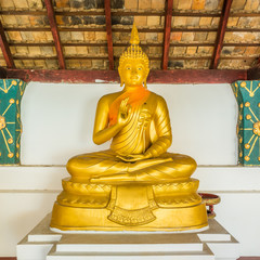 The golden statue of Teaching Buddha pose. This posture signifies wisdom, understanding, and...