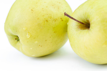 green apple with water drops close-up macro, background