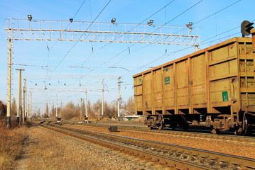Fototapeta na wymiar View on the railroad track and cargo trains