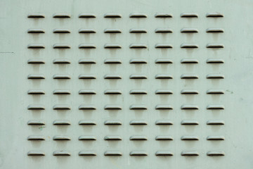 The metal plate with narrow air vents. Holes for the escape of hot air.