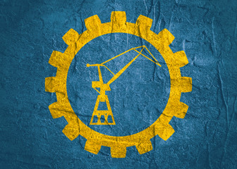 Cargo Sea Port Crane icon in gear. Minimalistic sign on concrete textured background. Trendy Flat style for graphic design