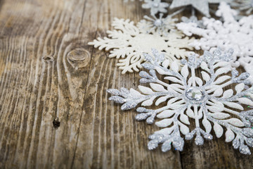 Christmas ornaments on the wooden background.