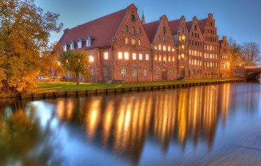 Historic brick buildings on Trave River. Lubeck, Germany