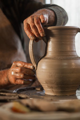 Fototapeta na wymiar Potter working a piece of clay