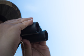 Close-up Of Human Hand Holding Binoculars