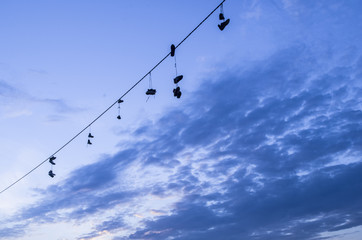 Shoe-flinging on a power cable.