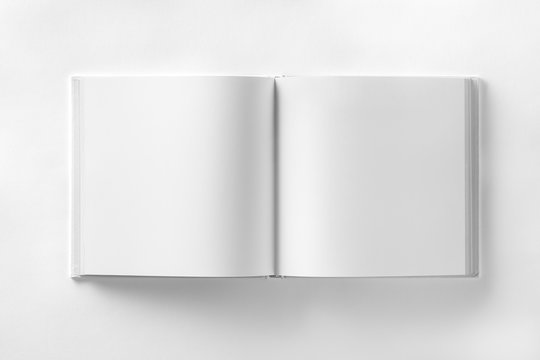 Mockup of opened blank square catalogue at white paper bacground