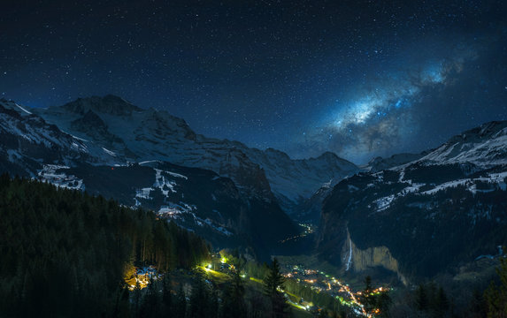 Milky way over fairytale-like Lauterbrunnental and the snowy Jungfrau, Bernese Oberland, Switzerland