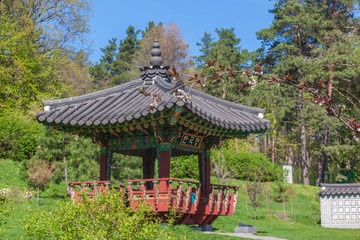 Fototapeta na wymiar Korean traditional garden and pagoda in a public garden in Kiev