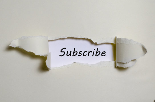 The word subscribe appearing behind torn paper
