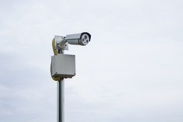 Surveillance camera on the sky while the sky's overcast, looks like it's going to rain