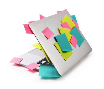 Image of laptop full of colorful sticky notes reminders isolated