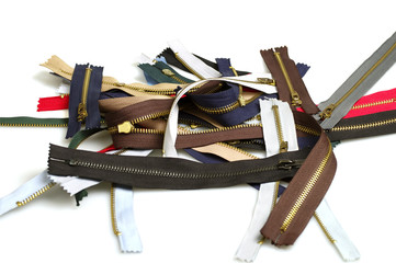 Metallic jeans zippers on white background