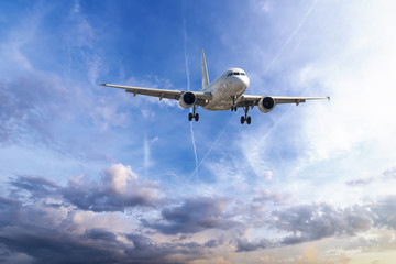 Fototapeta na wymiar Passenger plane take off from runways against beautiful cloudy s