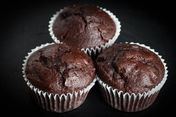 Chocolate muffin on dark background.