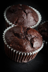Chocolate muffin on dark background.