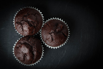 Chocolate muffin on dark background.