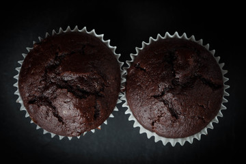 Chocolate muffin on dark background.