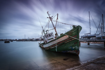 Old fishing boat aground