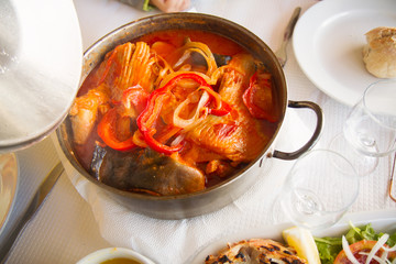 portuguese dish caldeirada in iron pot