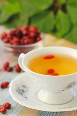 Tea with rosehip on a table. Useful drink for health. Herbal tea.