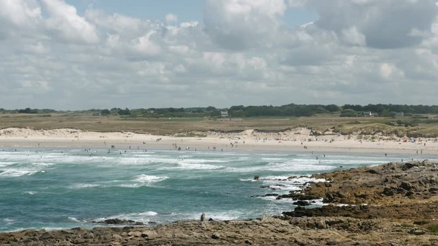 Unspoiled coastline with rocks and beaches on the famous surfer spot Pointe de la Torche in Brittany, France on a beautiful summer day.