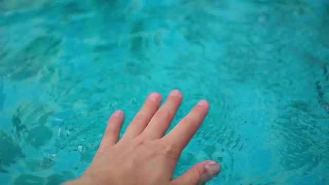 hands in the pool water, spray, drops