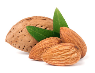 almonds in their skins and peeled with leaf isolated on white background