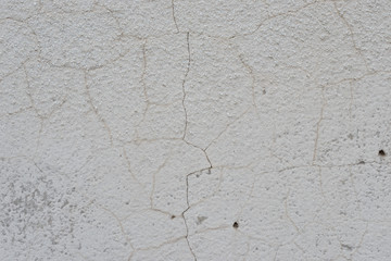 Wall fragment with scratches and cracks