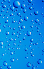 Nice blue abstract background from different sized water drops