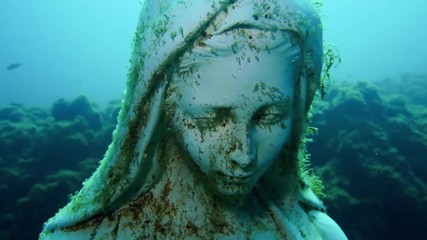 Underwater Virgin Mary statue 