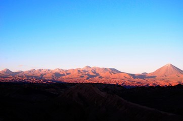 Naklejka premium Panoramic view of the Moon Valley or Valle de la Luna close to San Pedro de Atacama in Chile, South America during sunset