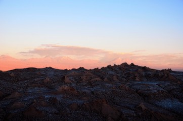 Fototapeta na wymiar Panoramic view of the Moon Valley or Valle de la Luna close to San Pedro de Atacama in Chile, South America during sunset