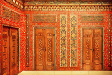 Fototapeta na wymiar Calligraphy and paintings on the doors of 17th century Aleppo room, Syrian house. Pergamon Museum in Berlin