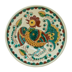 Covered with glaze ceramic plate handmade. Isolated on a white b