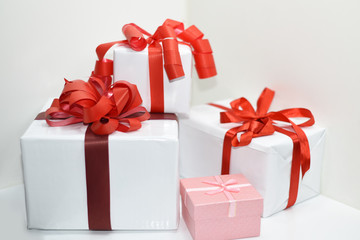 White presents with red ribbons