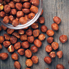 Hazelnuts filbert on wood background
