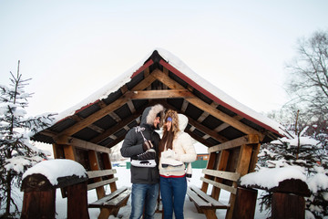 Winter couple in love, cold weather and warm clothes