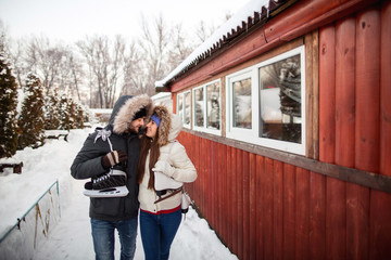 Winter sport and recreation, happy couple with skates going to the training of winter games