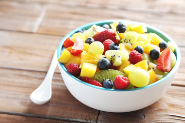 Fresh fruit salad on a brown wooden table