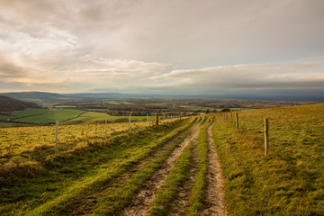 Footpath on Wolstonbury Hill, South Downs, Sussex, England taken on an autumn late afternoon,