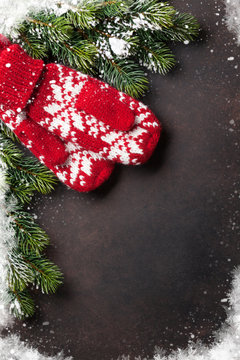Christmas background with fir tree and mittens