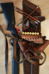 Rifle ammunition,  bandolier, ramrod and shotgun