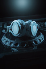 DJ sound equipment at nightclubs and music festivals, EDM, future house music and so on. Parties concept, sound technique. DJ playing on the best, famous CD players.