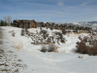 Large houses overlook snowy valley