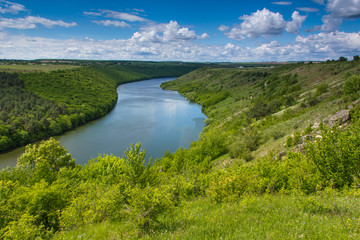 Fototapeta na wymiar The scenic summer landscape. View of bend of the river. Panoramic view from the hill. 